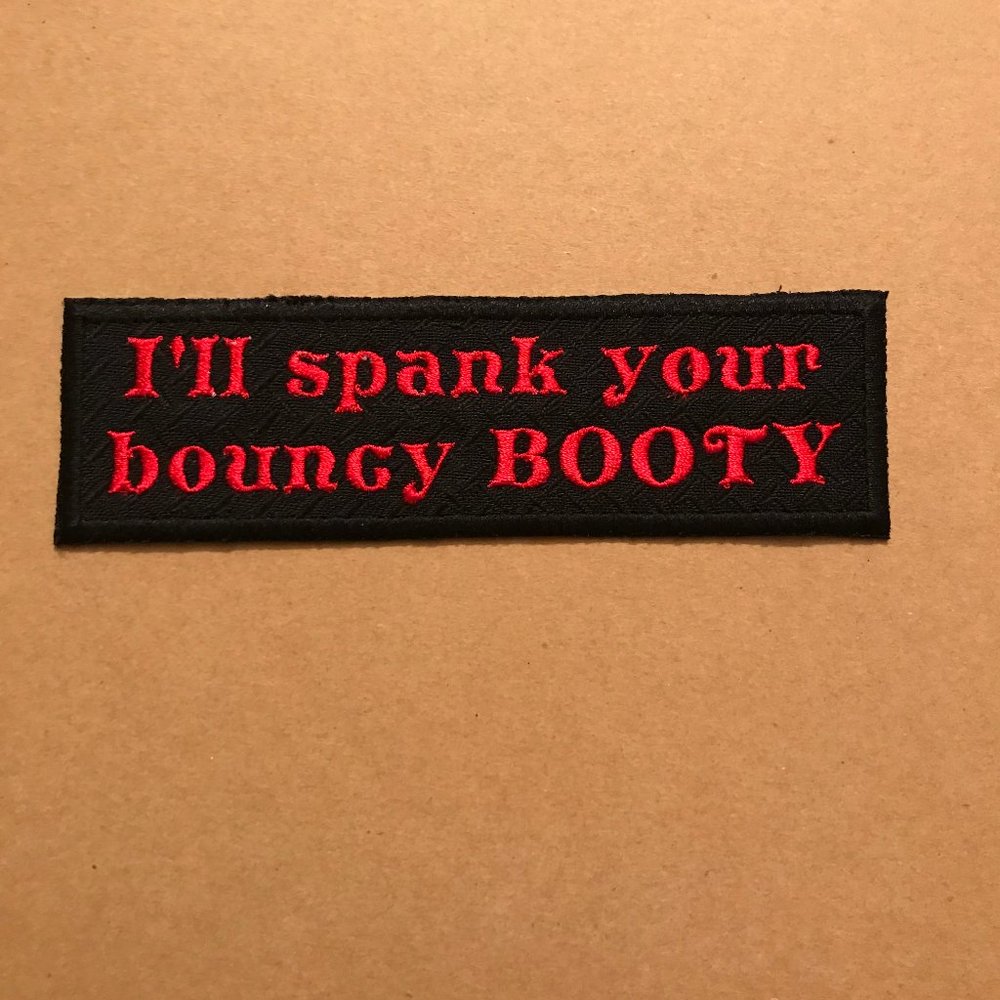 crazy embroidered patch "I'll spank your bouncy booty" black with red lettering